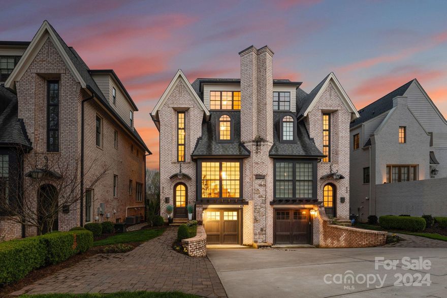 Welcome to luxury living at its finest in the heart of Dilworth! This stunning, updated townhome epitomizes elegance and sophistication, boasting a prime location within walking distance to all the attractions of Southend. Recently updated with exquisite marble accents throughout, pristine 8" white oak flooring with herringbone design in the entry, and luxurious new lighting fixtures throughout, every corner exudes opulence. In the Chef's Kitchen discover custom cabinetry & Thermador appliance package including a 36" range, paneled refrigerator + dishwasher, & built-in microwave. The living room off the kitchen opens out to a private balcony. The upper level primary features a vaulted ceiling with wood beams and tons of closet space. Step into tranquility in the serene backyard oasis, complete with a peaceful waterfall, offering the perfect retreat from the hustle and bustle of city life. Don't miss the opportunity to make this meticulously crafted townhome your own slice of paradise.