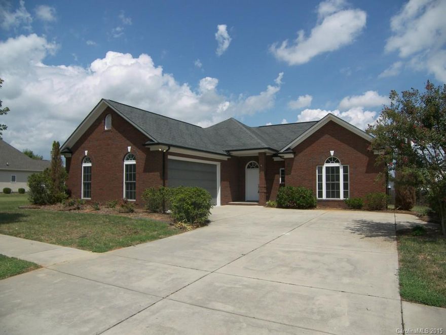 WOW! Like new! Lovely, freshly painted 3 bedroom ranch with maintenance free brick exterior. New carpet! New stainless steel dishwasher! New stainless steel range/oven! Floor plan has good flow. Great kitchen, perfect for entertaining. Great room has open and airy feel. Built-ins in Great Room. Two full baths. Master bath with garden tub. Attached 2 car garage. Lots of natural light. Bright and beautiful and ready to move in!