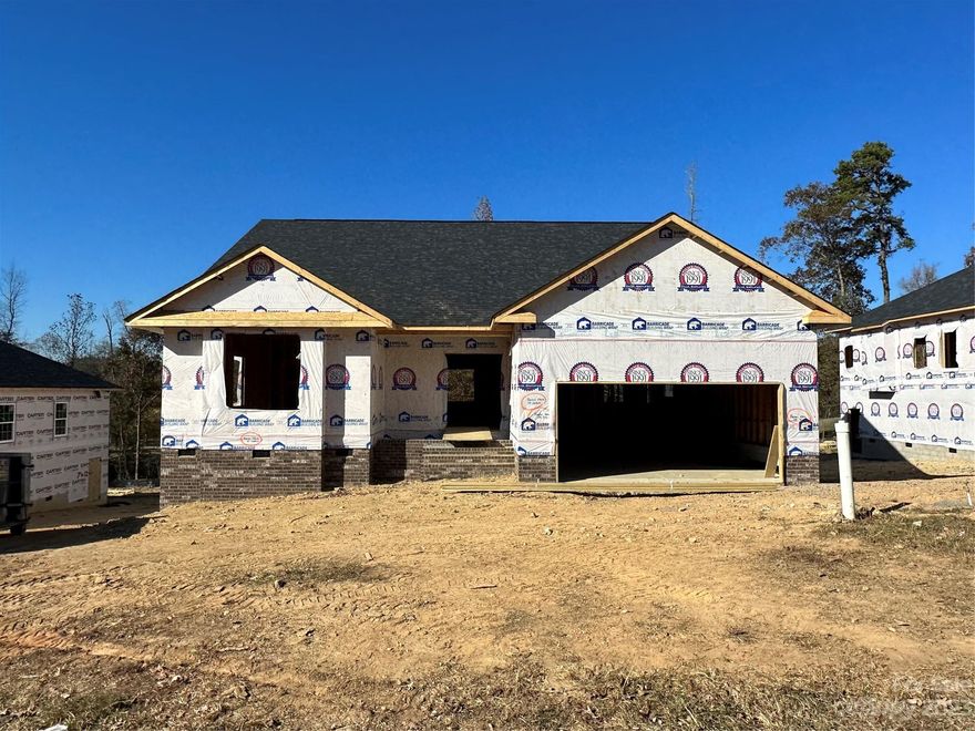 Only $1000 down to write contract! This new construction home is situated on Redbridge Golf Course in the beautiful city of Locust. This amazing 2604 sf ranch with FROG boasts 3 spacious bedrooms on 1st floor and 1 on second floor. Open spacious kitchen with walk-in pantry and large island over look family room with gas fireplace. This fantastic home is absolutely perfect for entertaining. Granite countertops, tiled kitchen backsplash, stainless steel appliances, gas range, laminate wood flooring throughout the main areas and primary bathroom with 5' tile shower are all included.  Enjoy the spectacular golf course view from the 16 x 14 covered deck. Home is currently  in mechanical rough ins. Estimated completion February 2024. 1-2-10 yr warranty. $10,000 towards rate buy-down and or options. Closing costs paid with use of preferred lender. All home features are subject to change without notice.  See agent for current incentives