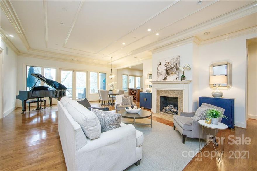 Settlers place is a unique boutique community of only 21 homes offering the discriminating buyer the utmost in luxury and privacy. Unbeatable location on Settlers park and just one block from both Tryon St. and 4th Ward Park. This luxury three-bedroom, three-bath corner unit with large open living/dining room has a gas log fireplace, tray ceiling, extensive molding, and a wall of windows that open onto a 400 square foot private terrace with amazing views of the skyline. The library/den features built-in bookcases and a second gas fireplace.