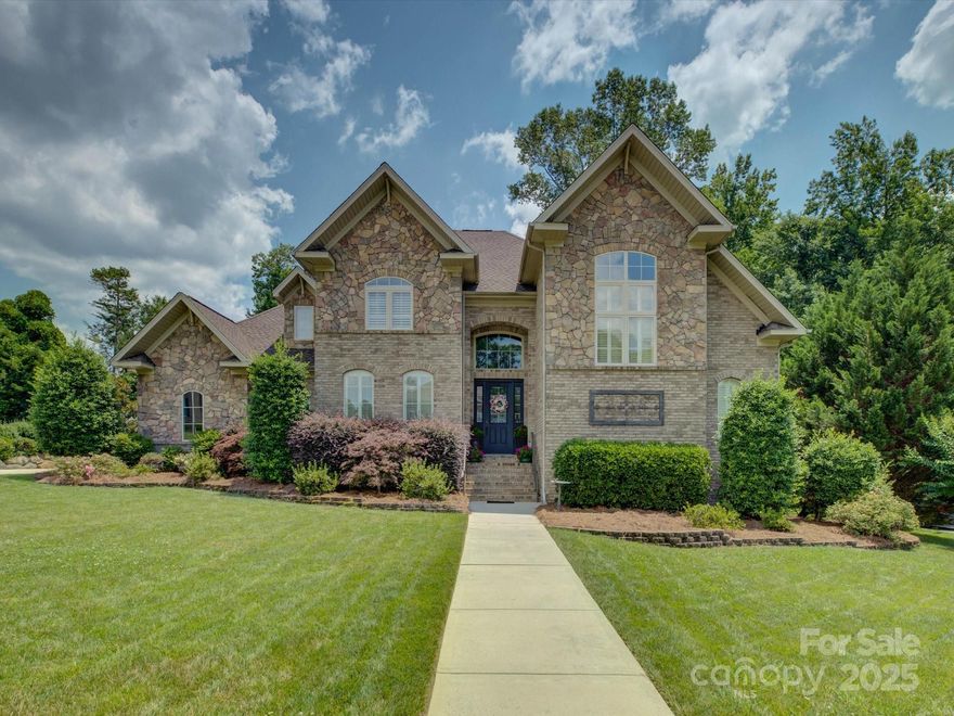 Welcome Home! As you enter this custom home, you will be surrounded by high ceilings, extensive moldings, plantation shutters, and hardwood floors that reflect the warm natural light throughout the home. The updated kitchen is appointed with stainless steel appliances, quartz countertops, marble backsplash, and ample seating for family and friends at the countertop bar. 

The first-floor primary welcomes you every morning with plenty of sun and a view of the private backyard where flowers and shrubs bloom throughout the year. The customized closet features hardwood floors, ample shelves, drawer storage, and adjustable hanging areas. 

Upstairs, you will find an additional primary with an oversized bathroom. Each additional bedroom has unique features, from an A-frame ceiling to a huge closet. 

This all-brick custom home is situated in a desirable neighborhood in Rock Hill in a quiet cul-de-sac, with a screened-in porch for privacy, a large patio, and beautiful landscaping!