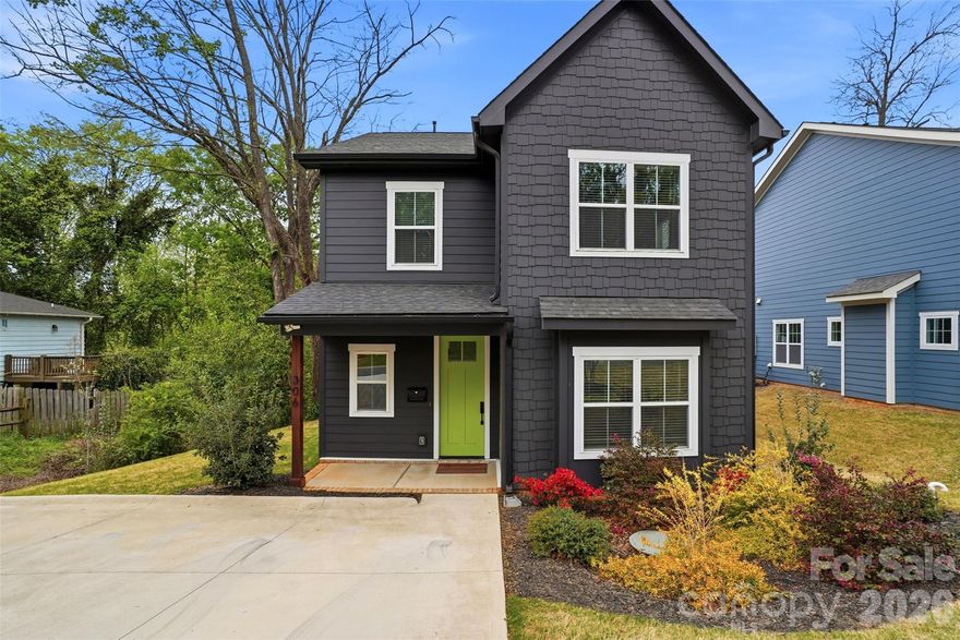 Modern living just minutes from Uptown Charlotte with NO HOA! This beautifully maintained home is just 3 minutes to downtown and 12 minutes to CLT Airport. Inside, you’ll find 9’ ceilings throughout, LVP flooring, neutral paint, modern light fixtures and ceiling fans, along with abundant natural light. The cozy gas fireplace anchors the main living area, while the kitchen is a standout with quartz countertops, tile backsplash, stainless steel appliances, gas cooktop, double oven, walk-in pantry, and a large island with seating. The dining area opens to the backyard through sliding glass doors, creating seamless indoor-outdoor flow. Custom six-panel doors add an elevated touch throughout the home. Upstairs, the spacious primary suite features vaulted ceilings, a walk-in closet with custom built-ins, and an updated bath with double vanities with quartz countertops and a large walk-in shower with a frameless glass door. Two additional bedrooms, each with walk-in closets, offer plenty of space and storage. Step outside to enjoy a private, fenced backyard with a patio and pergola, ideal for relaxing or hosting guests. Additional highlights include window treatments throughout, meticulous care by a single occupant, and remaining builder’s structural warranty for added peace of mind. Don’t miss this one!