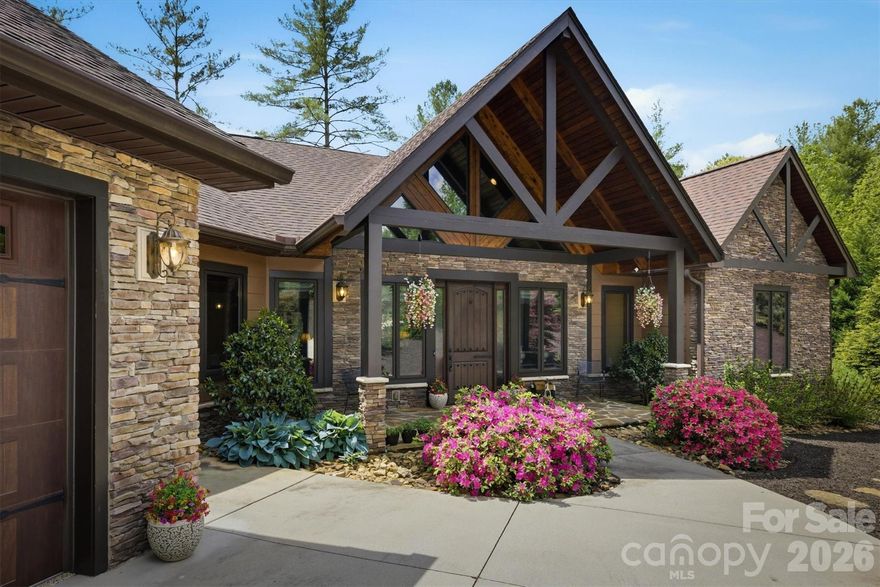 Tucked within the gated community of The Coves Mountain River Club, this home offers the perfect blend of comfort, recreation, and mountain lifestyle. This inviting home features 3 bedrooms plus a versatile bonus room, ideal for guests, a home office, or hobby space. The living room and primary bedroom shared a romantic pass through fireplace. The spacious finished basement is designed for entertaining, complete with a large recreation area, electric fireplace, and bar for gatherings year-round. A dedicated workshop/storage room adds functionality, while the main level showcases vaulted ceilings and a walk-in laundry/mud room for everyday convenience. Outdoor living shines with a deck featuring a screened-in section and a lower concrete patio, complemented by a swim spa and mature landscaping that enhances privacy. From your property, enjoy direct trail access leading to the community’s scenic riverside amenity area along the Johns River. Residents of The Coves Mountain River Club enjoy an unmatched amenity package, including the Pisgah Mountain Lodge with pool, hot tub, fitness center, and wraparound decks showcasing breathtaking 360-degree views of the Blue Ridge Mountains. Additional features include a riverside pavilion with outdoor kitchen, community garden and vineyard, pickleball courts, putting green, over 25 miles of nature trails, and two equestrian centers. Bordering Pisgah National Forest and nestled along the Johns River, this location is a haven for outdoor enthusiasts, offering kayaking, fly fishing, hiking, and more. As a designated dark sky community, evenings are just as magical, with incredible stargazing opportunities. Enjoy an active social atmosphere while remaining conveniently located just 15 minutes from downtown Lenoir, less than 30 minutes to Blowing Rock, Hickory, and Morganton, and approximately 75 minutes to both Charlotte Douglas International Airport and Asheville Regional Airport. Experience mountain living at its finest—welcome home!