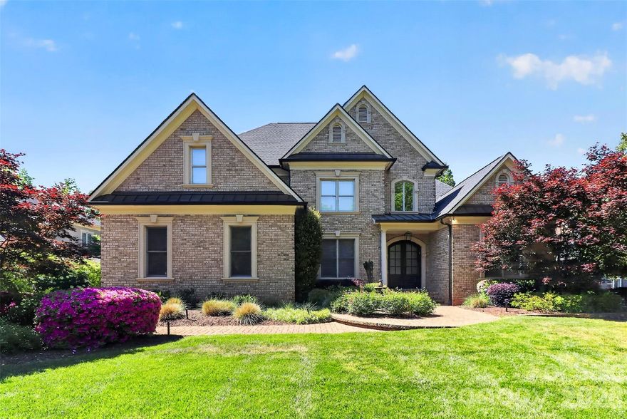 Extensively updated in 2021, this light-filled home combines luxury finishes with a functional layout and exceptional indoor-outdoor living.
Spacious chef’s kitchen and breakfast area feature Viking, Thermador, Miele, and Sub-Zero appliances, abundant workspace, oversized kitchen island with built-in storage, and a custom barista bar overlooking the pool and golf course.
The primary suite offers new flooring and a fully updated spa-like en-suite bath with frameless shower, floor-to-ceiling tile, soaking tub, and a custom HUGE walk-in closet.
Upper level includes 3 bedrooms, all with en-suite full baths, plus a bonus Den and additional office/sitting space. All baths have been updated with white cabinetry, and the upper level features new flooring and carpet throughout.
The finished walk-out basement provides flexible space for recreation, theater, or extended living, complete with a kitchenette and a secondary primary suite with full en-suite bath, offering three primary-style suites in the home.
Outdoor living is a standout feature with a covered main-level porch to enjoy the west setting sun, walk-out access to pool and spa, professionally landscaped grounds, lush garden, and expansive green space. Trellis features and an outdoor fireplace enhance the setting, creating a private and inviting backyard retreat.
Additional features include indoor and outdoor multi-room audio system, sprinkler and alarm systems, extensive storage throughout, new walkway added from drive and new roof (approx. 3 years old).
Enjoy all that Ballantyne Country Club has to offer including walking trails, dog park, playground, and HOA events. Optional country club membership with multiple membership options available.