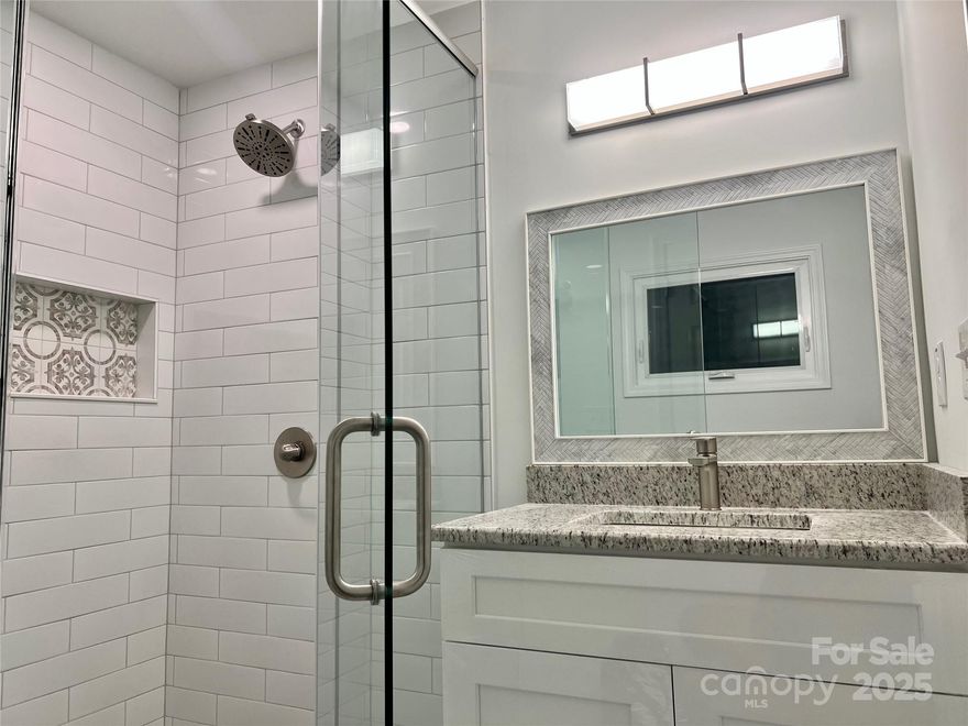 **Open House Saturday 3/7, 1:00-3:00pm**This is one you have to see in-person! AirDNA projection $42,000-$63,000/year income. Absolutely Beautiful home. When you are inside there is an essence that is hard to describe, it really feels like a home. When the home was being remodeled the windows were insulated with spray foam and most of the exterior walls were insulated with R-15, including new permitted and passed electrical with 200amp service. From the moment you walk in you step onto hardwood floors that have a gorgeous grain pattern through the kitchen, main living area, and two bedrooms. The master bedroom-with its wood floors, has an ensuite bathroom with a 36in toilet space and a HUGE shower that can accommodate more than one person with ease. All of the cabinets are brand new heavy duty plywood construction that are soft to the touch with soft close drawers and stainless steel handles to match the all new stainless steel appliances. All of the granite is stunning, beveled, with red flakes within the slabs that makes for an artistic contrast of elegance. And the guest bathroom...wow. The design of this home is something that you would find on very high end homes, which is what it is now. The home has not been certified green or energy star rated, but I wouldn't be surprised if it met the requirements. All new Norandex windows installed flawlessly, new 30-year architectural roof, R-15 insulation, New Goodman heating/cooling system with new boots, ducts, vents, new drywall, 5 1/4in baseboards, Gas water heater, Gas oven/range/gas furnace, and the list goes on. This home is truly a showcase that would be an excellent primary home or investment property. A house on the street just rented for $1,800/mo after 3 days on the market and another house on 4th street is also for sale for similar $/sqft. Located right beside of High Point University and Positioned Near to the High Point Furniture Market, this property can serve as a Primary Residence or an A+ Rental Property with No Deed Restrictions. This is the type of house that you need to see in-person. *Ask about Seller Incentives*