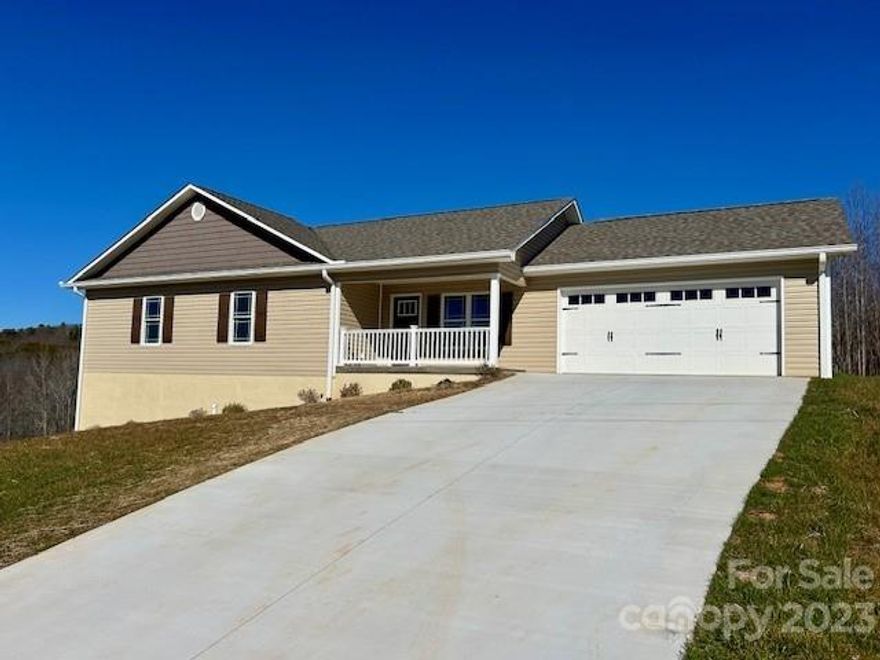 Brand spanking new!  Gorgeous new build offering 3 bedrooms, 2 full baths, a full basement and a double car garage!  AND AN EXTRA BUILDING LOT!  All of this and located in a well-established neighborhood between Lenoir and Hudson! This lovely home has so much to offer, including low maintenance flooring, an open floor plan with great lighting, a large working kitchen with incredible granite tops and stainless-steel appliances, a large primary bedroom with lots of closet space, and an open Great Room and Dining area.  The basement area is a wonderful opportunity for increased future heated square footage, a workshop or just plain old storage! This home has been both tastefully designed, and quality built and may be the home you've been waiting on! You are literally a 30-minute drive from the NC mountains or Hickory!  A shorter 5-minute drive to shop at Walmart Neighborhood or downtown Lenoir for local cuisine!