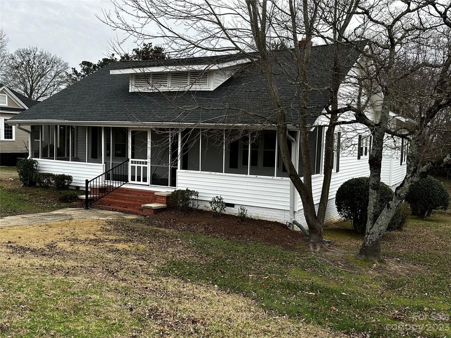 Beautiful home in the heart of small town USA is full of character! With formal living and dining spaces, hardwood floors and a front porch that was made for sitting, you'll see why this old soul has been dearly loved over the years. Formerly the manse for the neighboring Presbyterian Church, the home has a spacious floorplan with room for guests. There is a concrete patio out back and a fenced in yard. Underneath the home, there are 2 storage areas. The driveway is shared with the neighbor and leads to a detached carport. The HVAC has been recently updated and the roof is approximately 10 years old. Home has fresh paint and new floors. Outdoor enthusiasts will love the area- like Duke Energy's new 77 million dollar whitewater center, Carolina Adventure World, Rocky Creek sporting clays, the Carolina Thread hiking trail, and SkyDive Carolina, the 3rd largest of its kind in the country. This property is great for investors or a short term rental!