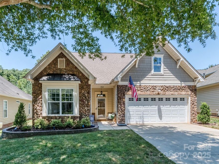 Welcome home to this beautiful ranch in sought-after Cobblestone! Step into a grand foyer with soaring 10 ft ceilings and gleaming wood floors that flow through the main living spaces. The renovated kitchen is a chef’s dream—updated white cabinetry, granite counters, modern backsplash, stainless steel appliances, double oven, and a lowered bar for extra seating and an open feel. The spacious living room is perfect for hosting family and friends for the holidays. Retreat to the lovely primary suite with tray ceilings, oversized windows, and a luxurious bath featuring a frameless glass walk-in shower, soaking tub, and a custom his-and-hers closet system. Enjoy peaceful mornings in the four-season porch or the extended patio as you sip coffee and listen to the gentle fountain in the pond just behind the home. HOA includes lawn care, making this truly easy living. This gem offers comfort, space, and style—don’t miss your chance to call it yours!