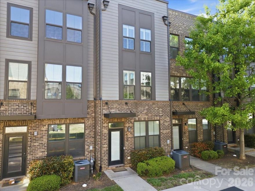 Step into modern luxury with this like-new four-story townhome in the heart of South End, just moments from shopping, dining, breweries, grocery stores, and the light rail. Designed for both comfort and entertaining, this home features a spacious rooftop terrace, attached two-car garage, and a chef’s kitchen with an oversized island, quartz countertops, and stainless steel appliances.

The main level offers a bright, open-concept layout connecting the living, dining, and kitchen spaces—perfect for hosting before a night out. The third floor features a split-bedroom design, including a spacious primary suite with a walk-in closet, dual vanity, and oversized walk-in shower, along with a well-appointed secondary bedroom and full bath.

The top floor adds even more versatility with a third bedroom, full bath, and flexible loft space that opens to the expansive rooftop terrace—ideal for relaxing or entertaining above the city.