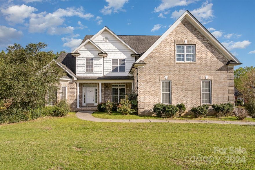 8-bedroom, 4 full bathroom custom built home in Fenton Dell! This home welcomes you with a grand foyer leading to the formal living room and parlor. Step into the open-concept family room with a gas fireplace, seamlessly connected to the kitchen with custom cabinets, granite countertops, a center island with stainless steel appliances. Two bedrooms and two full bathrooms located on the main level, including primary en suite. Upstairs, discover six spacious bedrooms and two additional jack-n-jill bathrooms, accompanied by generous sized closets and storage space. Enjoy outdoor living on the expansive backyard deck, perfect for entertaining. Complete with an oversized three-car garage and equipped with solar panels.