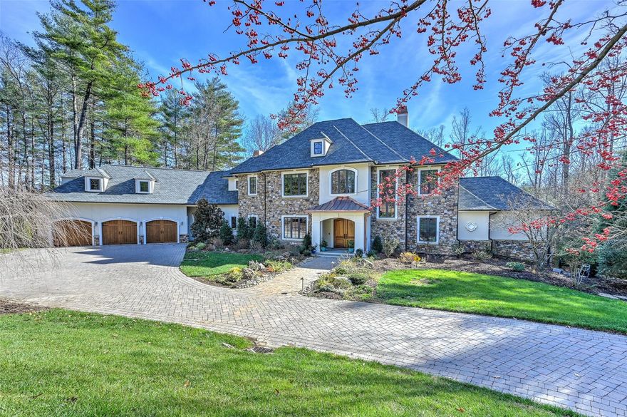 A price improvement has been made on this beautiful light-filled home that is located on a private lot in Biltmore Forest. The owners have updated the exterior with a new entry, slate composite roof, new garage doors, new hard stucco and extensive landscaping.Recent interior updates include hot water heaters, a whole house generator, new appliances in the laundry rooms, new central vacuum system and other upgrades (see attached list). The private primary bedroom includes a sitting area, a large bath with two separate sink areas, two large walk-in closets, an office and a private hot tub!  The kitchen area includes a large walk-in pantry. This home has high ceilings, and beautiful custom millwork. The outdoor entertainment area includes a built-in grill, a fireplace, and a recently added stone patio. Lots of storage! A $50,000 allowance will be credited at closing that can be used for buyers personal interior paint choices. This well maintained home is the best value in Biltmore Forest!