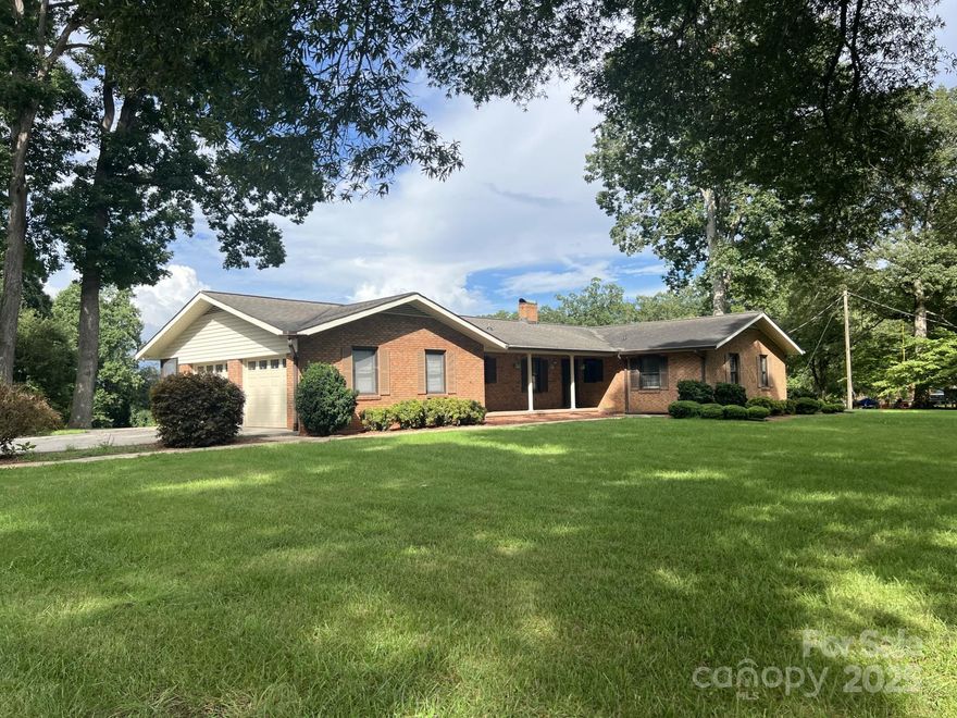 Fabulous home on almost 2 acres! 2 additional detached garages. New appliances. Tankless water heater. Spacious back yard with blueberry bushes!