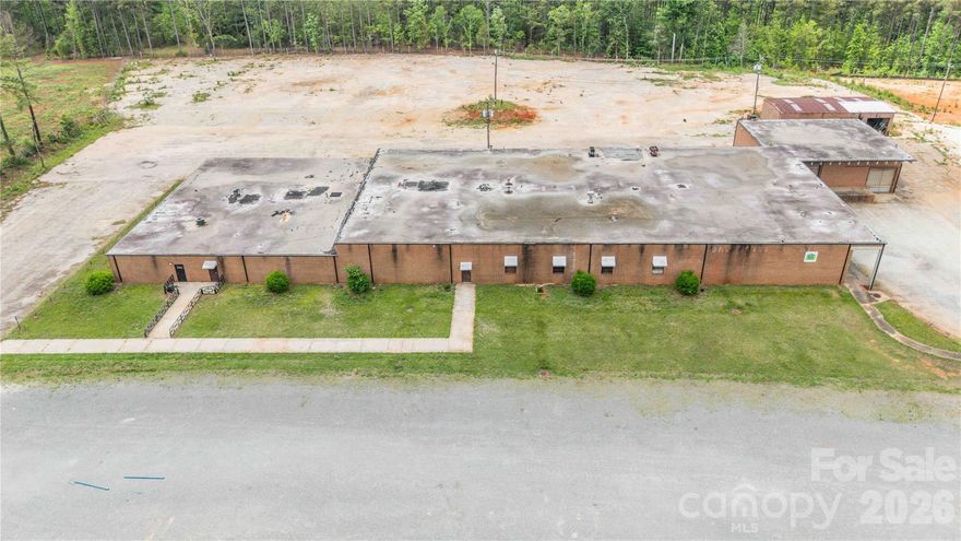 This versatile industrial/commercial opportunity offers over 30,000 SF of brick construction situated on 8.67 acres in rapidly growing Lancaster County. The expansive building features multiple separated sections ideal for office space, warehouse operations, storage, showrooms, manufacturing, distribution, or flexible multi-tenant use. Multiple loading docks service the main building, providing excellent accessibility for shipping and receiving operations. Heated and cooled office areas offer comfortable workspace, while the remaining portions of the building provide substantial open industrial space ready for customization.
A front parking lot accommodates customers and employees, with additional land behind the building offering potential for expanded parking, storage, or future development. A detached storage building further enhances the property's functionality and flexibility.
This offering becomes even more attractive with an adjacent parcel available for purchase. The adjoining parcel consists of approximately 12 acres of partially cleared raw land with existing driveways installed. All parcels have been county-approved for use as a concrete plant, creating exceptional potential for industrial users, contractors, manufacturing, or expansion operations.
Located in Lancaster County, an area known for aggressive industrial incentives and continued growth, this property presents a rare opportunity for investors, owner-users, or expanding businesses seeking flexibility, acreage, and future development potential.
Please note, this property is also listed for lease with MLS #4379966.  Refer to MLS #4380263 for the sale of LOT B and MLS #4380266 for the lease of LOT B.