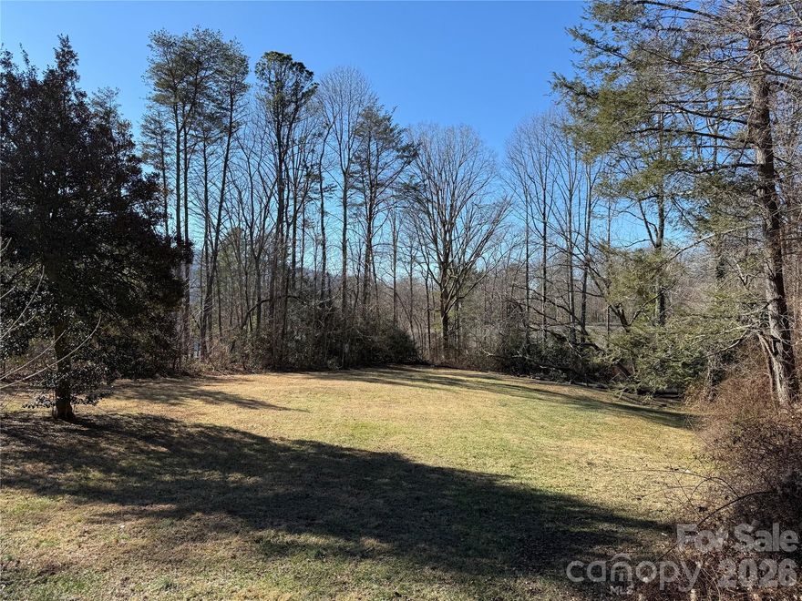 This exceptional 0.51-acre parcel at 109 W College Street represents a vanishing opportunity to build a custom masterpiece in the heart of Black Mountain, one of Western North Carolina’s most coveted small towns. Unlike the steep terrain typical of the Blue Ridge, this lot is mostly cleared and features a rare, gently sloping topography that significantly minimizes site work, grading, and foundation costs. This nearly level canvas offers maximum flexibility for architectural siting, effortless driveway access, and expansive outdoor living spaces designed to capture the surrounding mountain atmosphere. Zoned UR-8 (Urban Residential), the property supports a variety of housing styles and thoughtful, walkable development just steps from the town's vibrant core. Residents will enjoy immediate access to the "artistic soul" of Black Mountain—from the boutique shops, acclaimed galleries, and craft breweries of the Town Square to the scenic beauty of Lake Tomahawk and nearby hiking trails. With utilities available at the property line and cleared, in-town lots of this caliber becoming a true scarcity, this is a premier invitation to claim your place in a perennial favorite of America’s prettiest small towns.