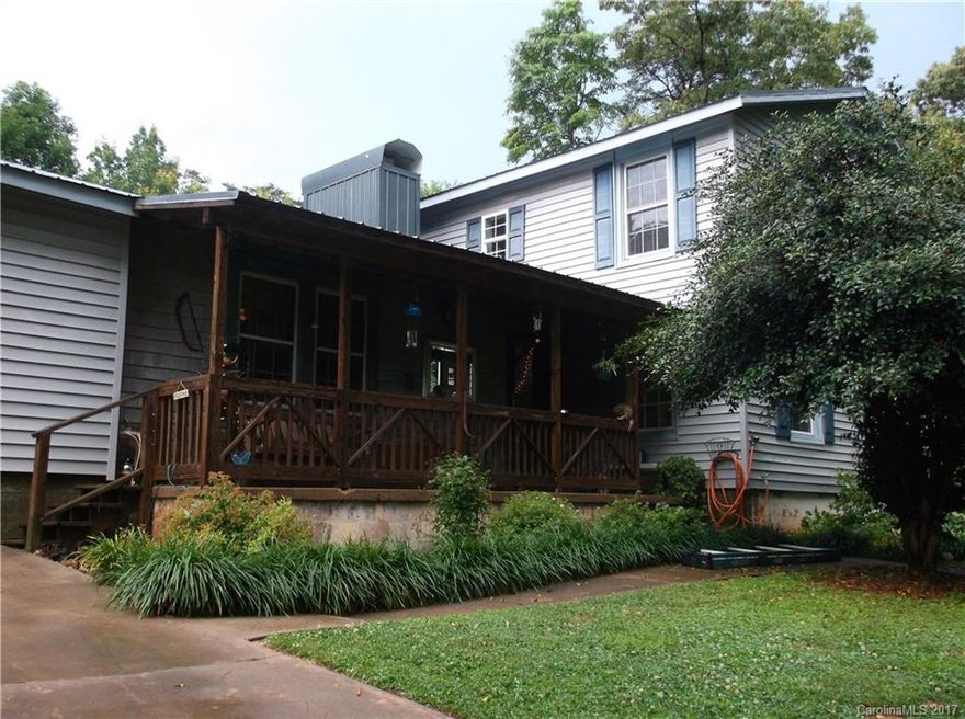 Charming 4/2 rocking front porch home. Newer AC and new metal roof. Large lot. Several storage buildings. Master suite and large master bath on 2nd floor.