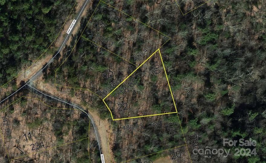 PRICE REDUCTION & SURROUNDED BY NC STATE PARK LAND & NC GAMELANDS! This level to gently sloping lot boasts a beautiful homesite w/elevations ranging from 2460-2530 feet affording nice Summer temps with mountain views and long range vistas. Located just 21 miles from Morganton and within the gated community of Pine Mountain Lakes, this lot provides a .55 acre homesite. Amenities within the community include a large private park with pond, streams, creeks and miles of beautiful forested greenway paths that provide ample hiking opportunities as well as a picnic pavilion and playground. Adjacent to this community, South Mountains State Park provides outdoor activities that include almost 50 miles of trail for mtn biking, hiking and horseback riding as well as trout fishing and water activities. Also adjacent is the NC Gamelands that provides a place to hunt! This is your opportunity to own & build your beautiful mountain home/weekend getaway surrounded by the backcountry of NC!