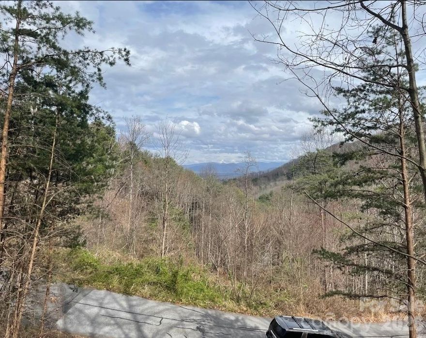 Look at this view from your future build site. 1.2 acres near Asheville, NC, one of the most sought-after mountain towns in the country. Flat, ready to build, in a private gated community just 15 minutes from downtown restaurants, breweries, and trails.