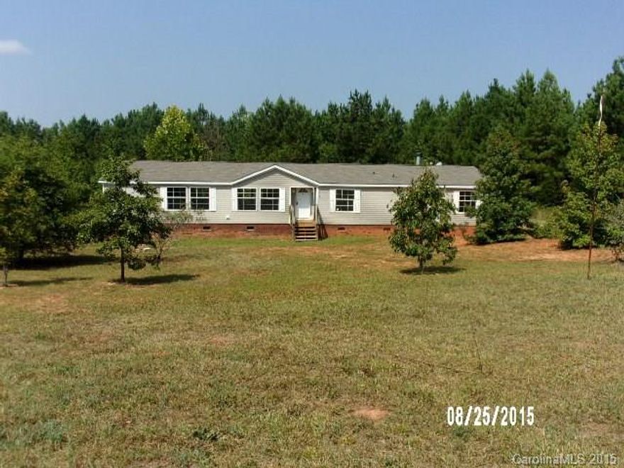 Large double-wide on an acre, spacious floor plan with 4 bedrooms and 2+ baths. Large lot with wooded areas.  Bank-Owned property, proof of funds letter required to submit all offers. Closing attorney to hold EM deposit. To be sold “as-is, where-is.” Cash buyers only.