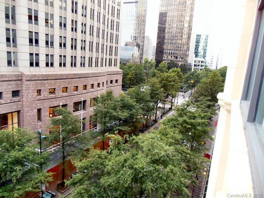 Luxurious corner penthouse unit. Lovely hardwood floors. New neutral carpet put into the bedrooms. Twenty foot ceilings. Gas log fireplace. Incredible views from every window. White kitchen cabinets with stainless steel appliances and granite countertops. Both baths have rich dark wood vanities with granite countertops. Secured building in the heart of uptown!