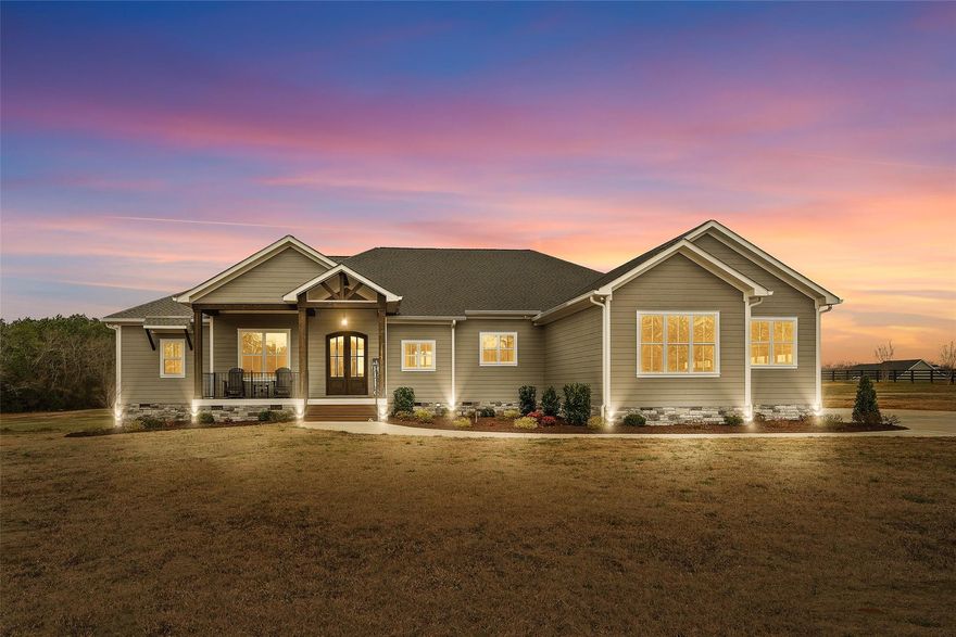 Luxury meets country in this newly built 4BR/3.5BA ranch home in Rock Hill on just over 14 ac of cleared land! The open chef's kitchen features an oversized Blue Flower granite island, 60" Forno Pro refrigerator, Frigidaire Gallery 36"cooktop & double oven, Carolina Heartwood cabinets and a beautiful walk-in pantry! The primary bedroom features an oversized suite and a beautifully appointed bath that is highlighted by a garden tub with lights and recirculating water that keeps water temp, a walk-around double shower, Satori porcelain tile, separate vanities with marble tops and entry into the expansive custom closet! The right side of the home houses the bonus/playroom and the 3 spacious bedrooms, one with its own bath and the other rooms sharing a jack-and-jill! Rear of home features screened porch and "toasted sand" Trex deck. The workshop is 2800 sq ft and has 4 roll-up bays, a 12 ft door, and 13ft ceilings. Just minutes from Rock Hill shopping and dining, this home has it all!