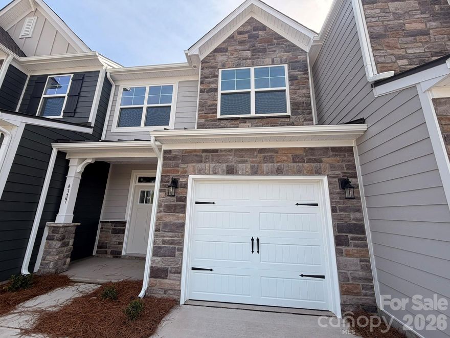 New townhomes in Harrisburg! This Ashland plan has 3 bedrooms, 2.5 baths, and more than 1,800 square feet of living space. The beautiful kitchen has Shaker-style, white cabinets, quartz counters, tile backsplash, and stainless appliances, including a gas range and microwave. The kitchen opens into the dining area and family room, which opens to the covered porch. Stairs with metal balusters lead to the upper floor that has a loft, laundry room, two secondary bedrooms, a hall bath with tub/shower combo, and the spacious primary suite. The primary bath has a tiled shower with a bench seat, dual-sink vanity, and a linen closet. All bathrooms feature white cabinetry and white quartz counters. Additional extras include a foyer with tray ceiling and Enhanced Vinyl Plank flooring throughout the main level. Community amenities feature a dog park, playground, paved walking trail, outdoor pool & cabana.