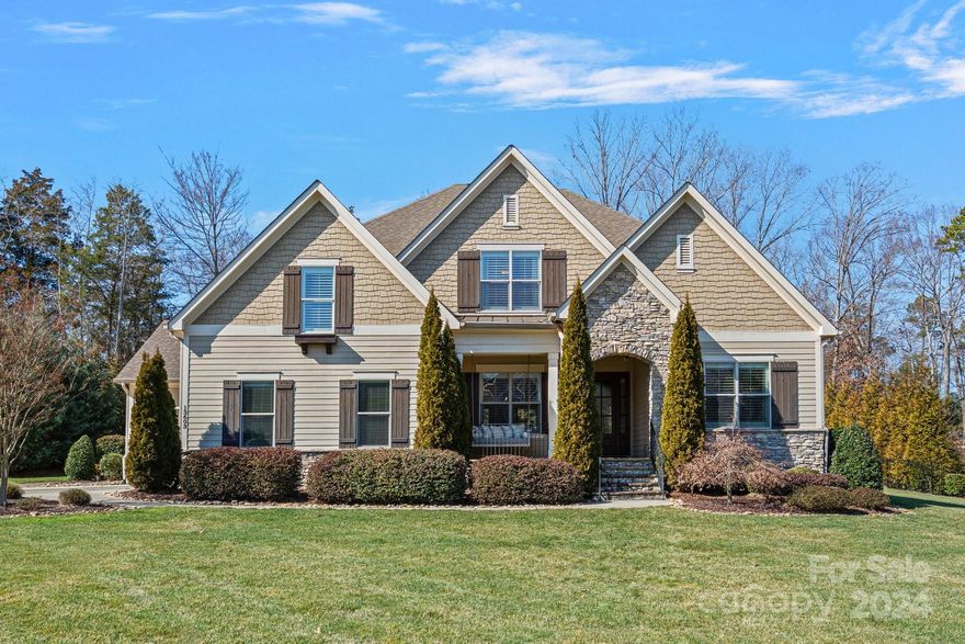 Beautiful custom home in highly desirable The Woodlands at Davidson. This home has it all! A welcoming front porch leads you to an open floor plan including an office with French doors, oversized dining room with custom ceiling, a large great room with fireplace and built-ins, and a gourmet kitchen with an induction cooktop, Sub-Zero refrigerator, large island, separate eating area, and hidden pantry. Off of the kitchen and great room is a screened-in porch with motorized screens that leads to a built-in, outdoor grilling area. The main floor primary suite includes a bathroom with oversized shower, double vanity plus separate knee space, and large walk-in closet. Head upstairs to find three more bedrooms, all with ensuite baths and large closets, plus a bonus room with wet bar. Home also includes a whole home backup generator. All this and easy access to award winning schools, parks, shopping, and highways makes this a home you will not want to miss.