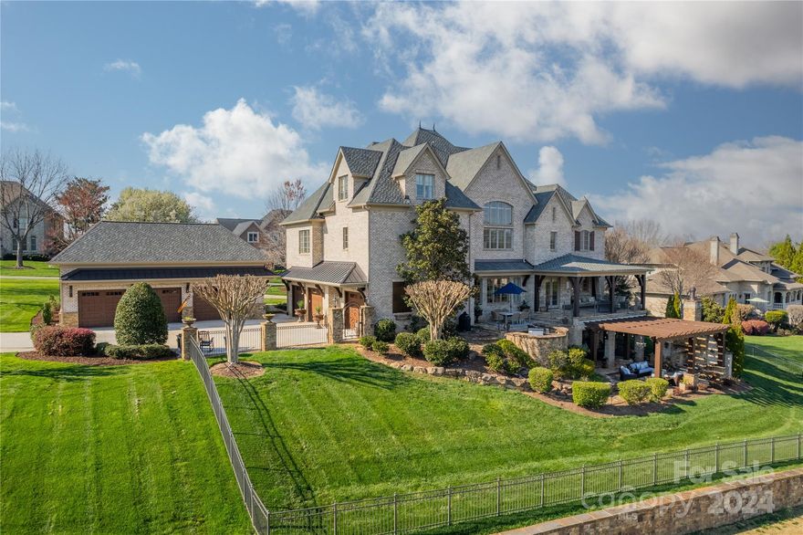 Timeless meets Luxury at this well appointed, quality custom built home. Beautiful views overlooking the 6th fairway, in this highly desirable golf club community. Each level has something for everyone, whether you want to wind down on the covered terraces, snuggle up at the outdoor fireplace, catch a movie in the theater, grab drinks at the basement bar after enjoying the sauna, etc... Don't worry about stairs, the elevator will take you wherever you wish. Private primary suite w/sitting area, huge closet & laundry/morning rm. The chef's kitchen w/Viking dbl ovens, six burner gas top w/griddle, pot filler & oversized island for entertaining. Working from home will be easy w/multiple offices, one on each level. Don't miss the temp controlled wine cellar and the heated/cooled detached workshop/hangout customized for a true car enthusiast. Great for multi-generational living. Top Rated Schools...Must see!