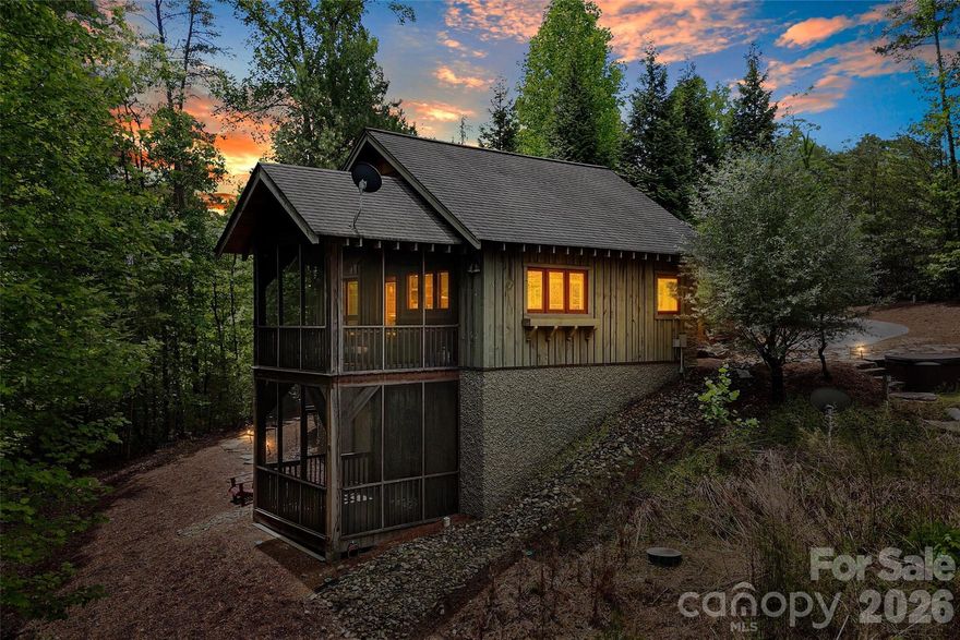 A rare Lake James opportunity in the sought-after Old Wildlife Club community—159 Osprey Roost Drive offers 1.25 acres of pristine waterfront living, a deeded boat slip a short walk away through the community, and the infrastructure already in place for future expansion.

Originally built as a temporary lake retreat with the intention of later converting the structure into a garage once the main home was built, this charming cabin now offers comfortable turnkey living with endless potential. The property includes a 5-bedroom septic permit/system, creating a valuable head start for those dreaming of building a full-size custom lake home.

The existing cabin features one bedroom and one full bath upstairs, as well as an upstairs loft, plus an additional bedroom and half bath downstairs. Two screened porches invite you to slow down and enjoy the peaceful surroundings, while professionally designed landscaping by Appalachian Hardscapes adds thoughtful beauty to the setting.

Additional features include a 30-amp RV hookup with hot tub service already in place, radon mitigation system, monitored alarm system, and an active termite bond for added peace of mind.

Sold turnkey and including both indoor and outdoor furnishings, this property is ready to enjoy immediately—whether as a private lake escape, future dream home site, or investment opportunity.

Adding to the privacy, the adjacent 4-acre parcel belongs to the Old Wildlife Club community, helping preserve the natural buffer and giving the property a tucked-away feel.

Ownership also includes membership access to Camp Lake James, offering resort-style amenities including swimming pool, fitness center, pickleball courts, paddling access, gathering spaces, and on-site dining options exclusively available to community members and guests.

This is a truly unique chance to secure pristine Lake James waterfront property with valuable infrastructure, privacy, amenities, and future potential already in place.