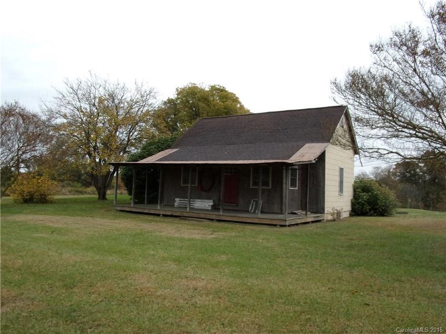 1.30 acres of land with beautiful view of mountains. Older home in need of renovation. Bathroom has been renovated. Great potential!