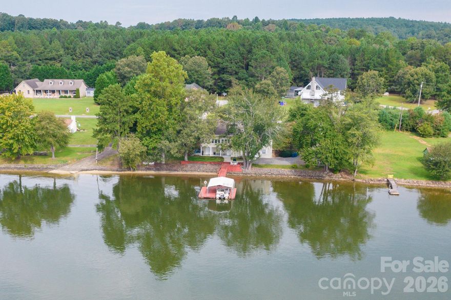 Your Lakefront Playground Awaits

Make every day feel like a vacation with this rare lakefront property featuring a front-row seat to Lake Hickory's most popular boaters' gathering spot — the Sand Bar.  Where boaters come to tie up together and enjoy the summer. With approximately 200 feet of shoreline and a covered boat dock, this property provides the perfect setting for boating, swimming, and lakeside entertaining.

This is the place where friends tie up, families gather, and memories are made. Spend your days swimming, cruising the shoreline, or hosting unforgettable lakeside cookouts while soaking in the wide-open views. From sunrise adventures to sunset celebrations, this property delivers the perfect backdrop for recreation and togetherness.