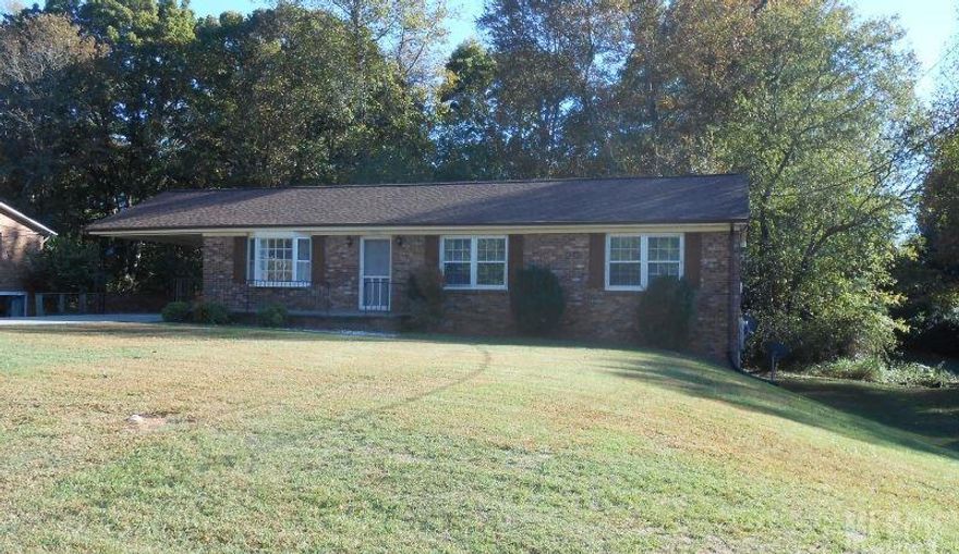 Brick ranch with full basement nestled in convenient location in NE Hickory. Three bedroom, 1.5 bath, eat-in kitchen, freshly painted interior, new flooring & more. Basement is mostly finished & offers den, extra room & lots of storage! New roof, hot water heater & driveway in 2013.