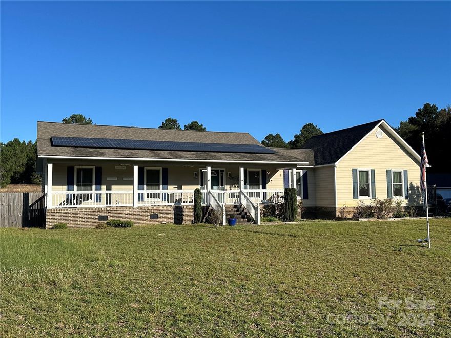 ESCAPE the city/suburbs AND the HOA!  County living within an hour drive of Charlotte!  If you are looking for an established homeplace on acreage in a rural setting, this one may be for you!  This home and seven (7) acres is a great option for a homestead.  The home features a kitchen/breakfast area that was added in 2016 with two pantry closets and mud room.  The great room features a wood burning heater and access to the rear deck.  There is a dining room, two bedrooms with easy access to a full bathroom and primary bedroom with en suite bathroom, that features an oversized walk in shower and walk in closet. Enjoy the spacious front covered porch. The large wired shop/storage has lots of usable space and has a half bathroom and work sink. There is plenty of room to roam, relax, entertain or pursue your hobbies.