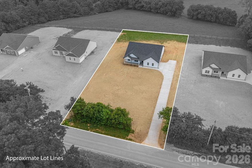 Experience elevated living in this beautifully crafted new construction home offering over 2,400 square feet of refined single-level design on a level .75 acre lot. This 4-bedroom, 2.5-bath residence blends modern style with everyday functionality—featuring no carpet throughout for a clean, upscale feel. Hardie board exterior accented with black trim for a clean, modern farmhouse look. The open-concept layout is filled with abundant natural light from expansive windows, creating a bright and inviting atmosphere. At the heart of the home, the spacious kitchen impresses with a large island ideal for gathering, soft-close cabinetry, walk in pantry, granite and sleek stainless steel appliances—all seamlessly flowing into the living and dining areas, providing plenty of room to spread out. A thoughtfully designed split-bedroom plan enhances privacy, highlighted by an oversized primary suite featuring a spa-like bath with dual vanities, a tiled shower with built-in seat, and a generous walk-in closet. Enjoy outdoor living from the welcoming front porch or relax on the rear patio overlooking the expansive, level yard. The oversized side-load garage, professionally epoxied, offers excellent space for a workshop, storage, or hobby use. Conveniently located with easy access to Highway 321, this home delivers the perfect balance of comfort, space, and accessibility.