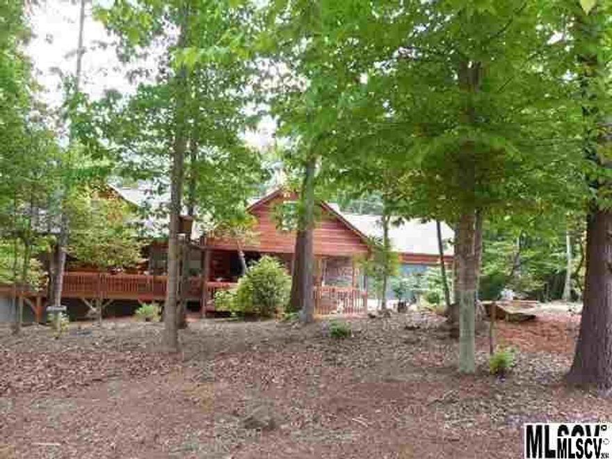 BEAUTIFUL MOUNTAIN-STYLE HOME IN KINGS CREEK! Almost new  beautifully maintained ranch with basement is ready to move in! Features open floor plan with granite counter tops and island in kitchen. Stainless steel appliances, two pantries... custom oak cabinets and hardwood floors. Cathedral ceilings and stone fireplace with gas logs in living room. Split floor plan with private master suite. Full basement has floor trusses and plumbed for full bath...easy to finish into a den. Plenty of storage and working area and exterior access. Big wide front porch spans the entire length of the home! Perfect for those rocking chairs! Also, nice covered deck off kitchen/dining for summer barbecues! Very nice wooded lot and easy to maintain. Seller just had exterior stained and maintained. Quality built by Dennis Harris.