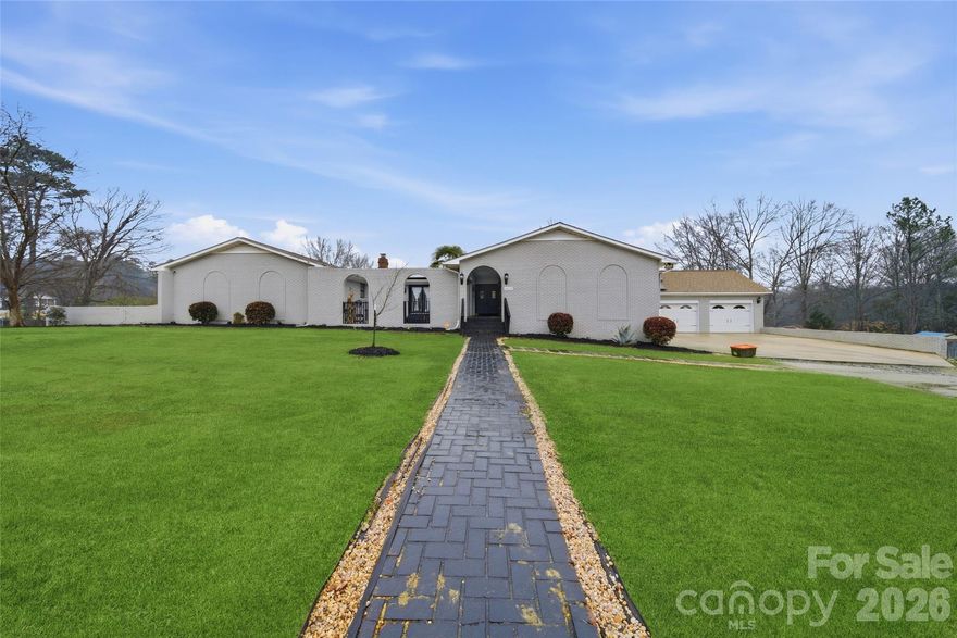 Spacious and Elegant! With over 4100 sqft, this beautifully updated, all brick home has everything you're looking for. The main living area has five bedrooms three full baths and one half bath. The entire home has been recently updated with tile floors a custom kitchen including new appliances and granite countertops. There's an oversized master suite with walk-in closets and plenty of storage. The additional living quarters has just over 1,000 ft, two bedrooms, one full bathroom, a kitchen and family room. It's accessible from the main home but also has a separate entrance for privacy.  All Plumbing and mechanical systems have been updated. New HVAC units. New water heaters. New vapor barrier and insulation in crawl space. The professionally installed solar panels have cut the utility cost by More than 50%. Nestled on a private 2 acre lot, with storage and out buildings.  This home needs nothing, yet has everything you're seeking and MORE! Schedule your viewing today!