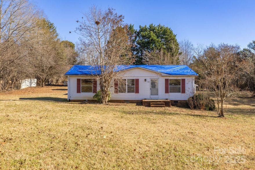 Nestled on 1.13 acres in Reidsville, NC, this 3-bedroom, 2-bath manufactured ranch home is packed with potential! Whether you're an investor, first-time buyer, or looking to downsize, this home offers a spacious layout and comes complete with a range, refrigerator, washer, and dryer for added convenience. While it could use some cosmetic TLC, the new well pump and disconnect provide peace of mind. Step outside and you'll find two detached sheds and a carport, offering plenty of storage and workspace. And here’s the best part— with a great offer, the seller is willing to provide a concession toward a new roof! Enjoy the tranquility of a private, peaceful setting, all while being conveniently located to the major roadways. This home is being sold AS IS, so don’t miss your chance to make it your own!