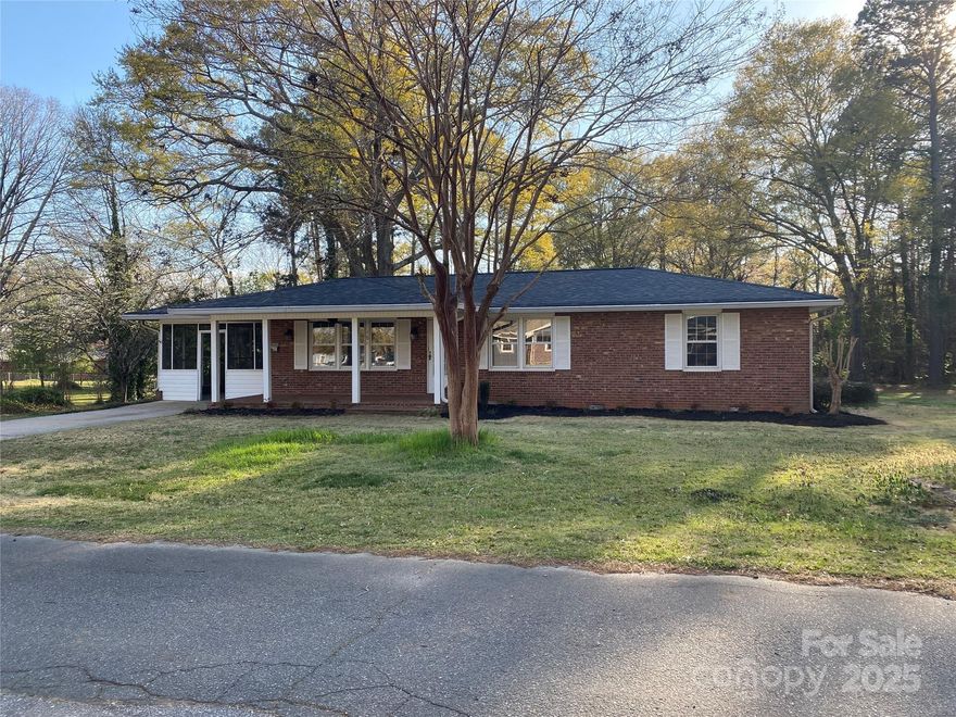 Beautiful ranch style home with 1.85 acres within the city limits of Forest City. If you want to live near town, but also want privacy, this home has it. House and .46 acres with adjoining lot of 1.39 acres , all at the end of a dead-end street. Home has been lovingly cared for, by the same family since they built it, in 1962. Beautiful hardwood floors throughout. Home features 3 bedrooms, a bath and a half bath, Living room, dining room, family room, kitchen, utility room adjoins kitchen. Step down into the spacious family room with large brick fireplace with built in blowers. From  the family room, step out onto the covered porch that overlooks the expansive back yard. Beautiful mature trees and shrubbery.
An attached carport has been made into a screened porch area with numerous possibilities. 
A two car metal carport is also on property. 
New roof - 2023
HVAC- 2015
Water heater - 2024
New 2025 built-in oven, cooktop, dishwasher and microwave.
Screened carport 288 sq ft