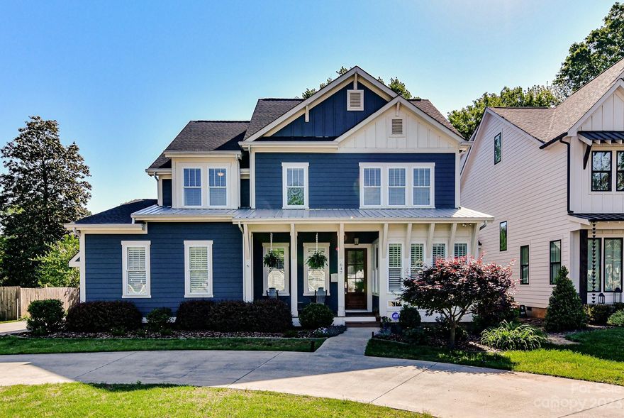 Xtras Galore! Tons of natural light! This meticulous custom built home features an open plan with 10ft ceilings, (coffered ceiling in family room) hardwoods through most of home,( third floor bonus room carpeted). Sunny front sitting room and large dining room, Both with plantation shutters! Gourmet kitchen with gas range, island, Stainless appliances and beverage fridge is great for entertaining! Kitchen Opens up to family room with new cabinetry surrounding gas Fireplace! Quartz countertops and extensive moldings throughout home! Some shiplap ceilings & walls, tons of recessed lighting!
 Primary Bedroom suite showcases elaborate bath & closet space with charging stations for electronics.  Enormous third floor bonus room has it's own beautiful bath! The yard is like no other! Huge incredibly landscaped, fully screened back porch,(including under floor area) designer patio, and an extra 2 car garage with ample storage space. Fenced, gravel pad for boat parking. And still room to play!