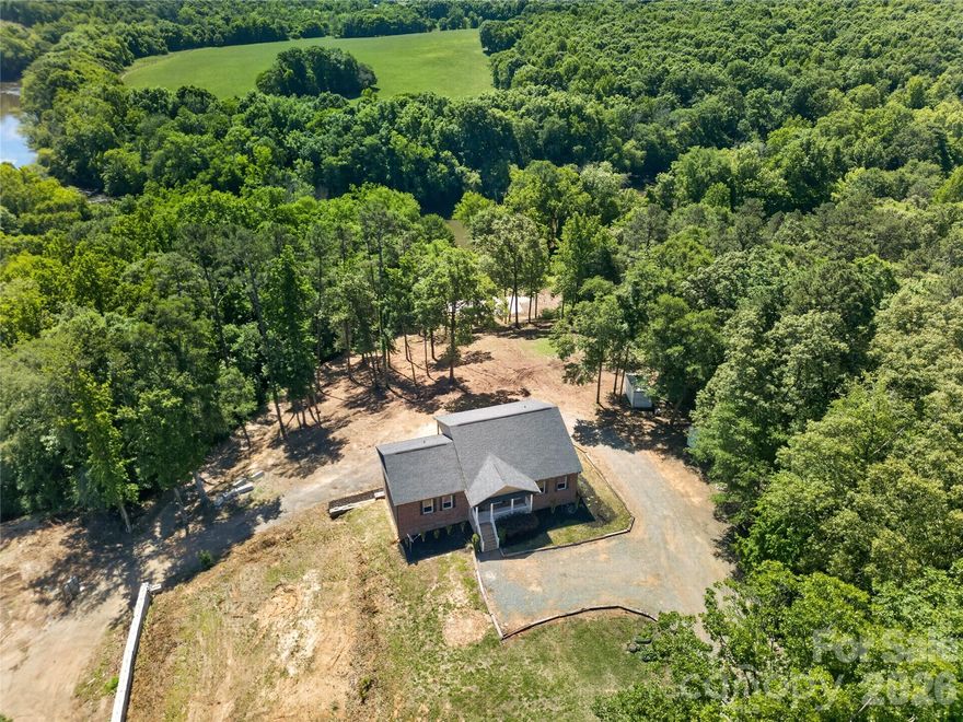 River views, acreage, workshop space & endless possibilities! This stunning property offers over 3,800 sq. ft. of living space on almost 6 beautiful acres with peaceful river views from both the kitchen and back porch. 
Property Features: 4 Bedrooms 3 Full Bathrooms Incredible gardening setup — perfect for hobby gardening or business use RV Pad with power, water & sewer hookups Massive 40x60 workshop with a large parking area — ideal for personal use, storage, or operating a business Privacy, space, and room to grow.  Includes a finished basement with a full kitchen! Whether you’re looking for a private retreat, space for your business, or the perfect property to enjoy country living with modern conveniences, this one truly has it all!