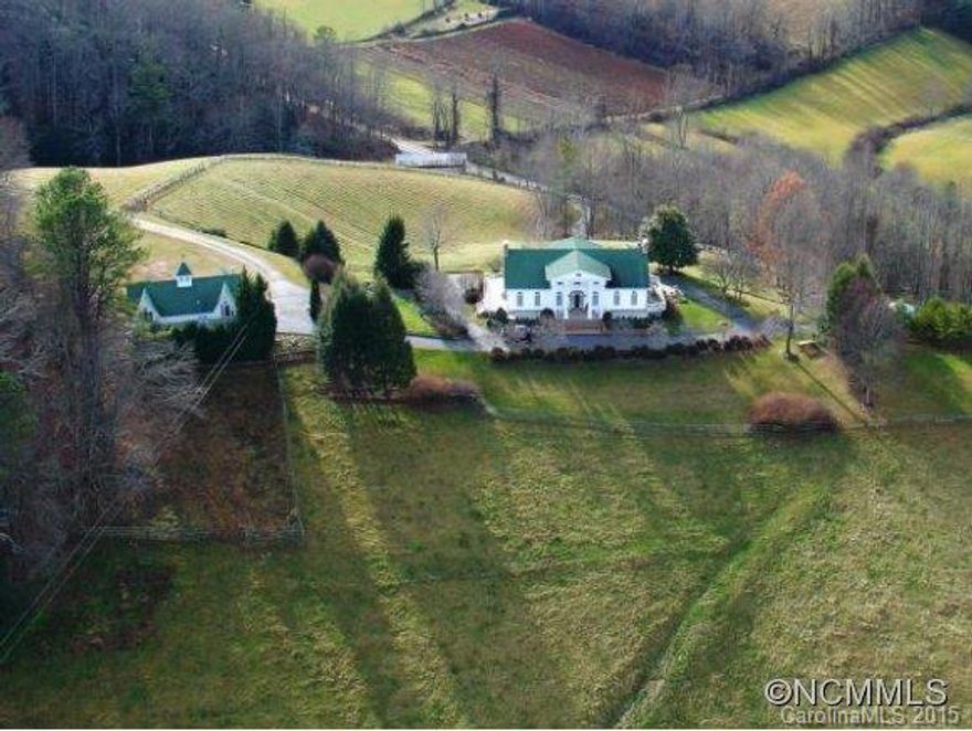 Twenty minutes from downtown Asheville. Magnificent Country Recreational Estate or Equine Estate on 38 acres w/6100 SF, 5 bedroom elegant Colonial style main residence with huge country kitchen and an amazing master suite, all with breathtaking views from every room! Stables, riding ring, tennis court, infinity pool and a two bedroom 1500SF Carriage/Guest House. Total of seven bedrooms on property in 7500 sf of living space.
