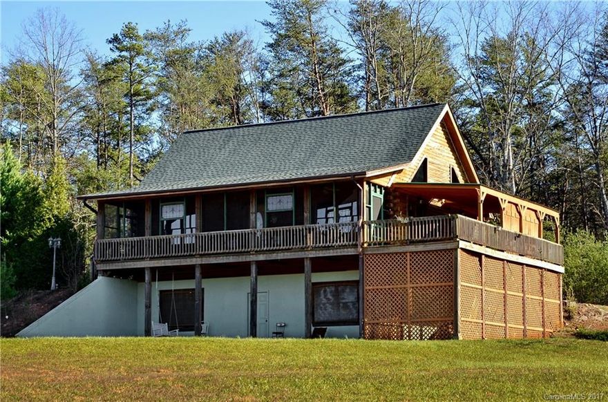 Enjoy a beautiful great room with beautiful fireplace with glass panels on both sides to allow la light filled room. Level lot with expansive mountain views. This charming log home with room partially unfinished basement for further expansion. Screened front porch provides protected  outdoor living area for enjoying scenic view. Great for year round living or a relaxing second home. Additional storage or potting 10 x 10 shed.