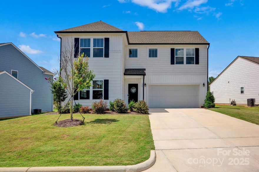 Built in 2023, this nearly new home in the Martha’s Ridge neighborhood offers the perfect balance of modern living and everyday convenience. Just minutes from Statesville Park and Soccer Complex, Statesville Fitness & Activity Center with Leisure Pool, and Signal Hill Mountain Bike Trail, it’s an ideal spot for anyone who enjoys staying active. The open floor plan on the main level welcomes you with a foyer leading into a bright living room, dining area, and stylish kitchen featuring a walk-in pantry, island with breakfast bar, subway tile backsplash, quartz countertops, and stainless steel appliances (refrigerator included). A convenient powder room is nearby for guests. Upstairs, you’ll find three bedrooms, two full baths, and a large laundry room with both linen and utility closets. The primary suite includes a spacious bedroom, dual-sink vanity, tub/shower combo with a garden tub, a walk-in closet, and a view of the natural area at the back of the lot. Both secondary bedrooms feature double closets. Step outside to enjoy the privacy-fenced backyard and covered patio, perfect for entertaining or relaxing evenings at home. Tucked away in a quiet, low-traffic area, yet only minutes to I-77, shopping, dining, and historic downtown Statesville, this home combines comfort, convenience, and a fantastic location.