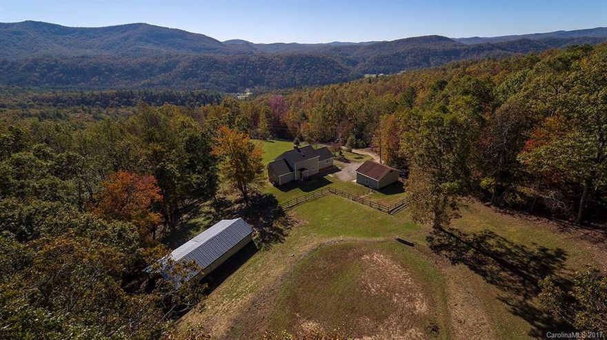 Remarkable equestrian mini farm overlooking Pinnacle Mountain & Dupont State Forest on nearly 12 acres. You will love the spacious open floor plan w/ all amenities on main level.  The spacious kitchen contains stainless appliances, gas range, quartz counter tops & large double sink. Detached two car garage w/ample storage upstairs. 600 sq ft 2 stall barn w/ tack room & large covered area. Approx 3 acres of pasture w/ riding ring. Bring the Horses! Very light restrictions 3 miles from Dupont.
