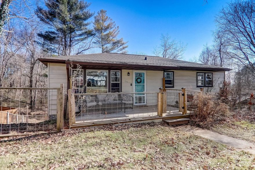 Lovingly cared for home in hot 28806 area code! Main level living with fourth bedroom in basement that can be used as an office, workspace, studio, or secondary living area. Plenty of open space in basement that walks out to covered parking. Large sloping lot with fenced yard. Less than five miles from downtown and roughly two miles into West Asheville.  Showings to begin Saturday 1/13.