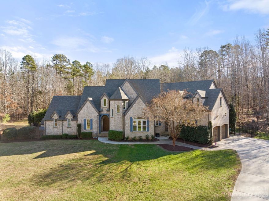 Luxurious residence nestled on 5.4 acres in the heart of Waxhaw. This exquisite residence epitomizes unparalleled elegance and sophistication. Upon entry, be greeted by soaring ceilings in the two-story great room with an abundance of natural light. The gourmet kitchen features cabinets galore and a spacious island, perfect for both intimate gatherings or entertaining guests overlooking the stunning backyard! Two primary bedrooms in this home with one located on the main level for your convenience and ease.  Finished basement complete with a kitchenette, additional bedroom and bathroom, as well as a media room! The backyard is a sprawling outdoor oasis, complete with a hot tub, lazy river pool, fire pit, and landscape lighting! Adding on to the already impressive features of this property are an attached 3 car garage and detached workshop with electric hook up! Don't miss the opportunity to view and indulge in the epitome of luxury living!