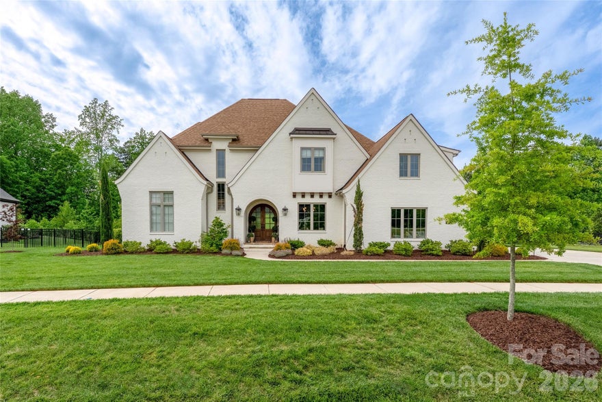 Experience elevated living in this stunning custom-built brick home thoughtfully designed with luxury, comfort, and functionality in mind. A welcoming foyer with rich natural hardwood flooring and a striking glass wine cellar immediately set the tone for the sophisticated interiors found throughout the home. The spacious great room, centered around a beautiful fireplace, offers the perfect setting for both everyday living and effortless entertaining.
At the heart of the home, the designer kitchen impresses with quartz countertops, premium finishes, and an incredible walk-in scullery and pantry. The open-concept layout flows beautifully into the living and dining spaces, creating an inviting atmosphere ideal for gatherings of any size.
The main-level primary suite serves as a private sanctuary, featuring a spa-like ensuite bath with a soaking tub, oversized frameless glass shower, dual vanities, and an expansive walk-in closet. Upstairs, you’ll find generously sized secondary bedrooms along with versatile bonus spaces perfect for a media room, home office, gym, or playroom.
Outdoor living is just as impressive, with a spacious covered rear porch overlooking a resort-style pool and hot tub surrounded by a private, fenced, wooded backyard. Completing the property is an attached three-car garage and exceptional curb appeal, all nestled in one of Huntersville’s most desirable locations.
