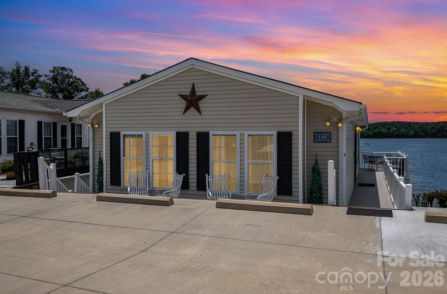 Enjoy unobstructed lake views from this beautiful 2-bedroom, 1.5-bath waterfront home located in the gated community of Badin Shores Resort. Whether you're relaxing on the spacious covered porch (added in 2020) or enjoying the scenery from the open-concept living area, the lake is always the backdrop. The updated kitchen features solid surface countertops and stainless-steel appliances. Incredible storage space is located downstairs off the covered patio. Step outside to direct access to the community waterfront boardwalk—perfect for a peaceful walk with stunning views. Resort amenities include a swimming pool, putt putt, basketball courts, sandy beach and lake swim area, fishing pier, stocked catch-and-release pond, clubhouse, boat ramp, on-site restaurant, and more. Experience the best of lake life in this active, amenity-rich waterfront community!