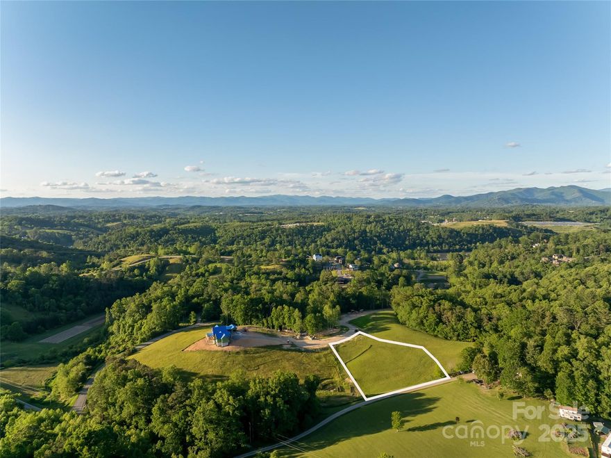 Experience life in Olivette—an award-winning agrihood along the French Broad River, just 12 minutes (under 7 miles) from downtown Asheville and featured in Martha Stewart Living as “the neighborhood of our dreams.” 124 Lilikoi Lane is tucked at the end of a peaceful cul-de-sac, offering 1.25 gently sloping acres ready for your custom build. With city water, sewer, underground utilities, and high-speed fiber internet, you’ll enjoy modern convenience in a setting designed to connect you to nature and community. Daily life here moves at a different pace. Step outside to walk wooded trails, spend time by the river, or visit the on-site organic farm. Whether you’re relaxing at home, meeting neighbors at a gathering space, or enjoying the outdoors, Olivette offers a balance of privacy, connection, and simplicity—just minutes from everything Asheville has to offer.