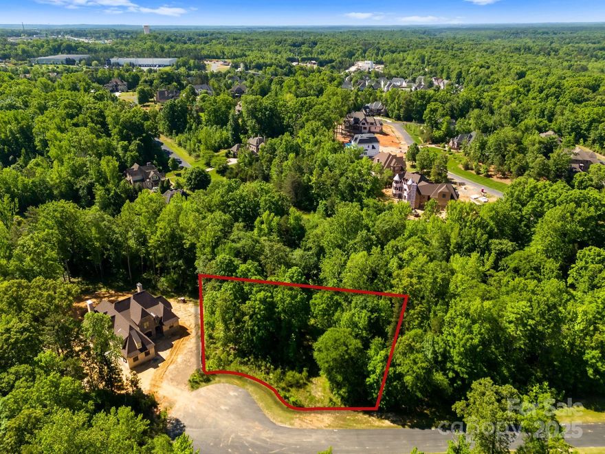 European style architecture with timeless style and breath taking landscape.  Established gated community that has exploded with many new beautiful custom homes. Minutes from Ballantyne and located within Indian Land booming with new commercial businesses, hospitals, restaurants and more.