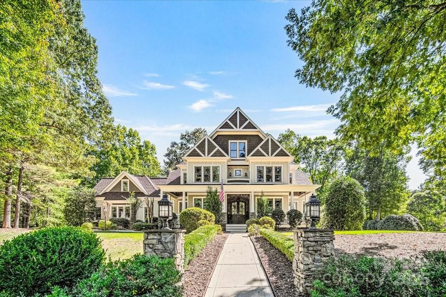 Experience refined luxury living in The Point, Mooresville’s premier lakefront community.. Situated on a private 1.17 acre lot, this elegant 5 bedroom, 4.5 bath residence offers 4,452 sq. ft. of refined living space. Highlights include cathedral ceilings and bold architectural columns. The serene backyard offers a spacious retreat, perfect for entertaining. The main-floor primary suite opens directly onto a beautiful wraparound porch—perfect for enjoying your morning coffee. Brand-new roof, completed in 2025. The home also features a dedicated movie room, perfect for family nights. Enjoy proximity to The Point’s premier amenities—clubhouse, dining, golf, and tennis—and a private boat slip (Pier Z, #55) providing direct access to Lake Norman.